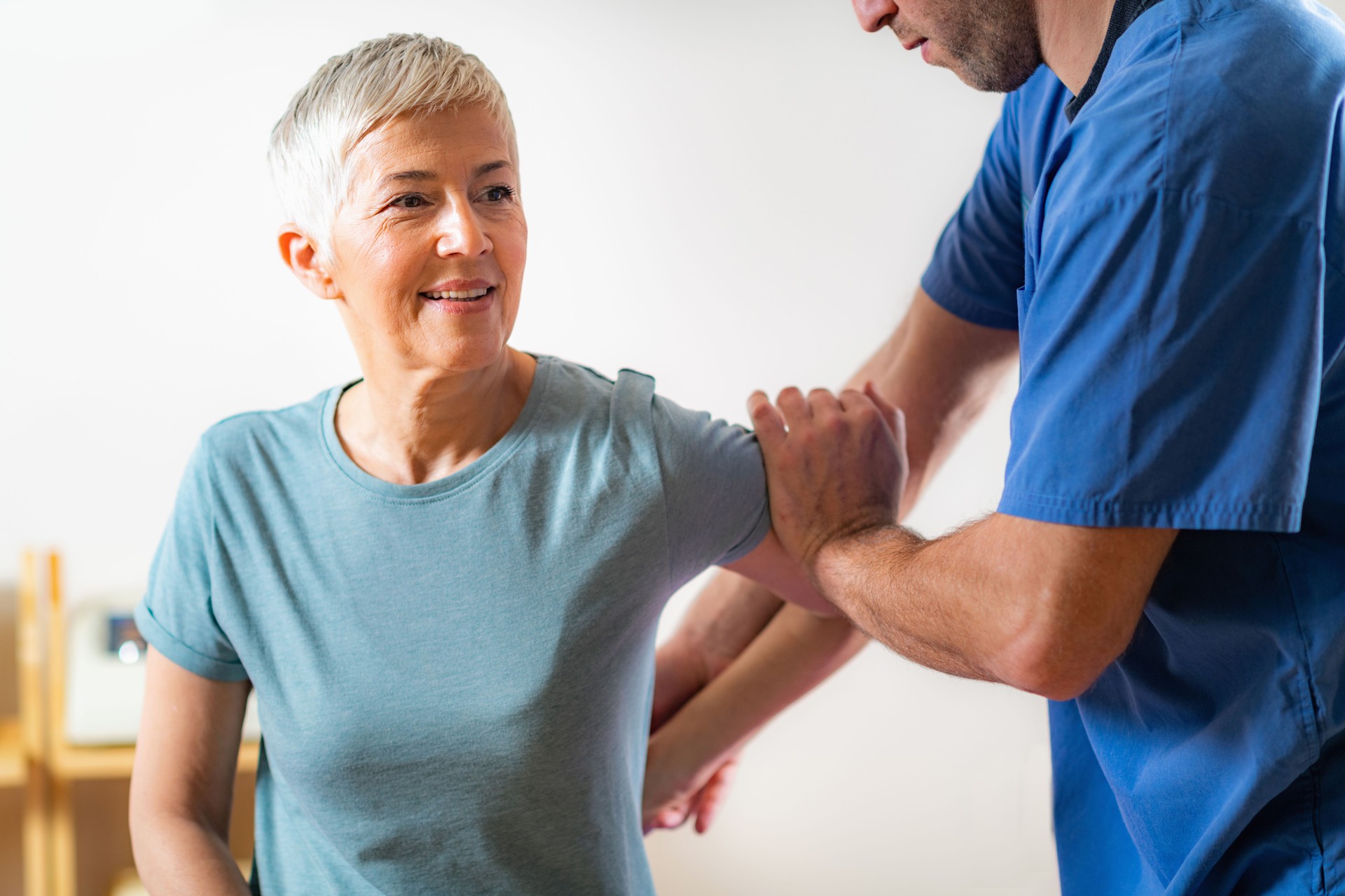 Senior Woman Visiting Physical Therapist